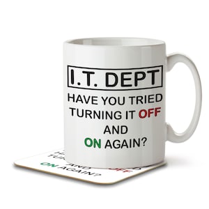 May include: White ceramic mug with a black and white graphic that reads "I.T. DEPT HAVE YOU TRIED TURNING IT OFF AND ON AGAIN?" The mug has a black handle and is sitting on a coaster with the same graphic.