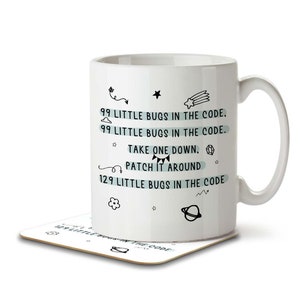 May include: White ceramic mug with black text that reads "99 little bugs in the code. 99 little bugs in the code. Take one down, patch it around 129 little bugs in the code." The mug has a black and white illustration of a star, a cloud, a shooting star, a flower, a planet, and a squiggly line.