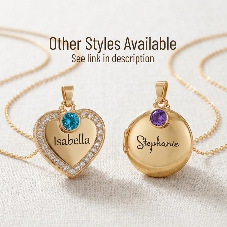 May include: Two gold lockets on chains. One is heart-shaped with a blue gemstone and the name "Isabella." The other is round with a purple gemstone and the name "Stephanie." The text "Other Styles Available" is visible.