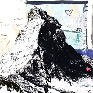 May include: Abstract art print featuring a black and white mountain with a hiker ascending. The words "FOLLOW YOUR HEART" and "HIKING" are visible. The background includes a heart and the words "MADE IN".