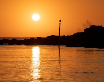 Photograph of a sunset near Kelonia on Reunion Island. Gift idea wall decoration for the house.