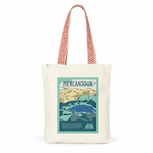 May include: A cream-coloured tote bag featuring a mountain and lake graphic with the word "MERCANTOUR". The bag has red and white patterned straps. The bottom of the graphic has the words "SORTE LONGUE".