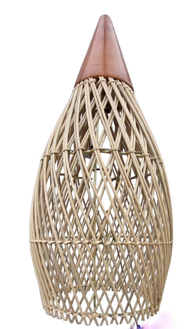 May include: A woven wicker lampshade with a brown leather top. The lampshade is shaped like a teardrop and has a delicate, intricate pattern.