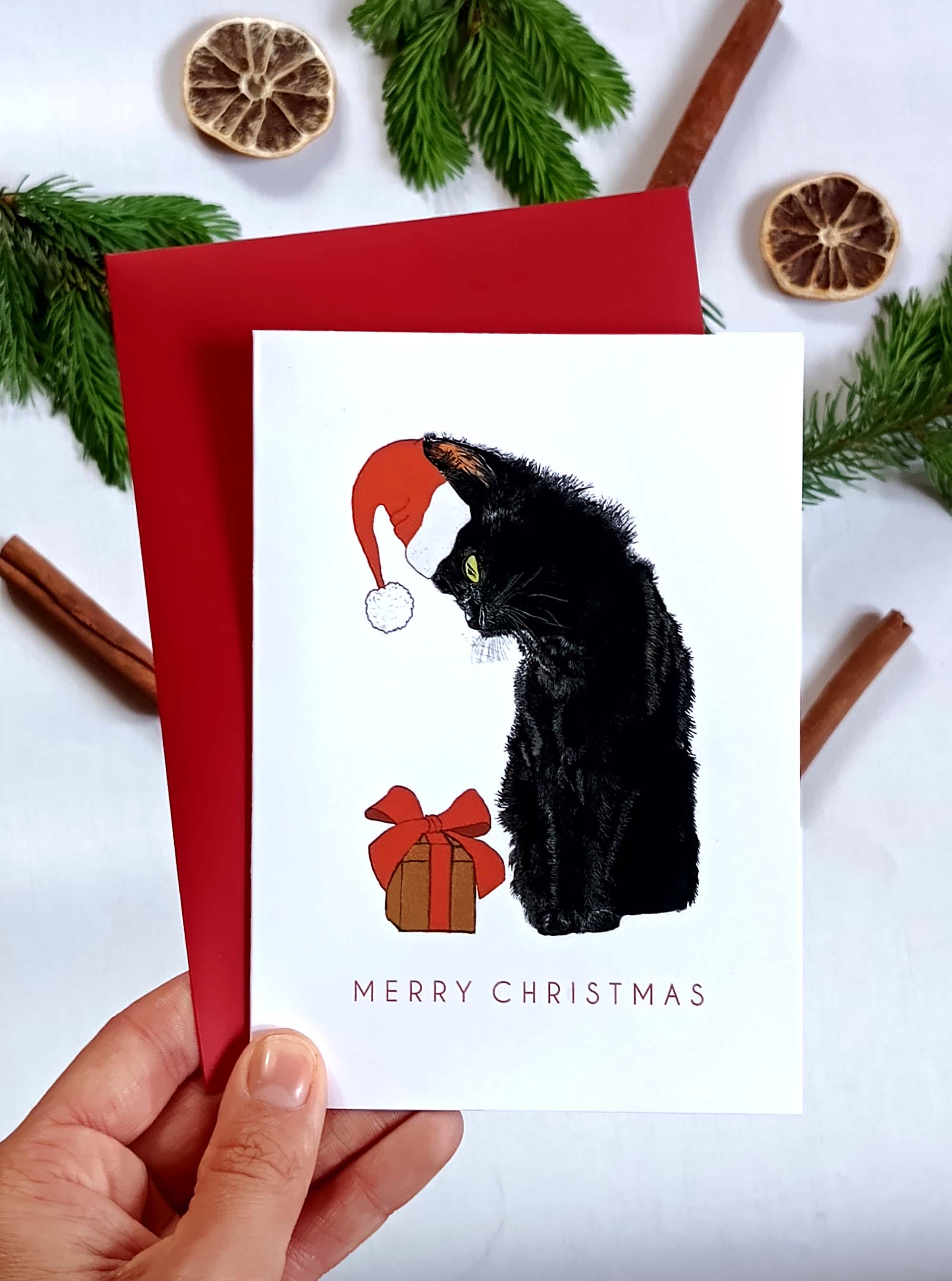 黒猫のクリスマスカード、サンタ帽をかぶったエレガントな動物、メリー