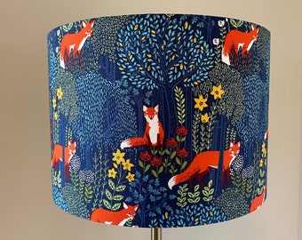 Fox in the Woods Vibrant Red foxes with a navy background drum lamp shade.