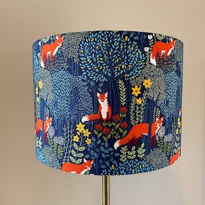 Fox in the Woods Vibrant Red foxes with a navy background drum lamp shade.
