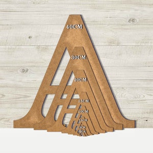 May include: A set of seven wooden triangle stencils in various sizes, ranging from 5 cm to 40 cm. The stencils are arranged in a pyramid shape, with the largest stencil at the top and the smallest stencil at the bottom.
