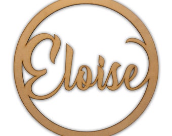 May include: A wooden circle with the name Eloise written in a cursive font.