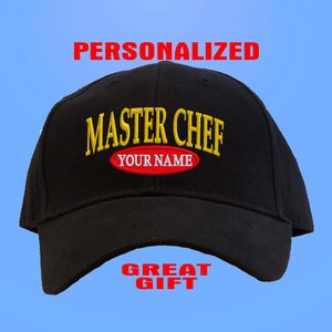 May include: Black baseball cap with the text "MASTER CHEF" in yellow and red with the words "YOUR NAME" in red. The text "PERSONALIZED" is above the cap and "GREAT GIFT" is below the cap.