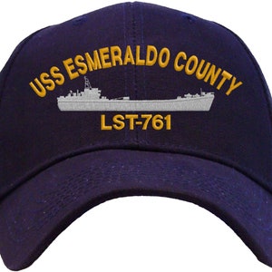 May include: A navy blue baseball cap with an embroidered image of a ship and the text "USS ESMERALDO COUNTY LST-761".