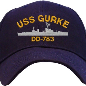 May include: A navy blue baseball cap with an embroidered white ship and the text "USS GURKE DD-783" in yellow.