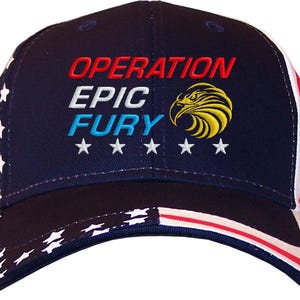 May include: Navy blue baseball cap with the words "OPERATION EPIC FURY" in red, white, and blue. The cap features a gold and yellow eagle emblem and white stars. The brim and side panels have a white star pattern and red and white stripes.