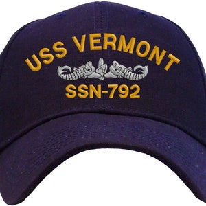 May include: A navy blue baseball cap with gold embroidered text that reads "USS VERMONT SSN-792".