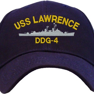 May include: A navy blue baseball cap with a white embroidered image of the USS Lawrence DDG-4 destroyer ship and the text "USS LAWRENCE DDG-4" in yellow.