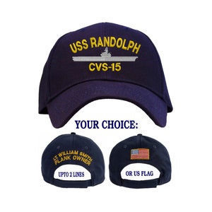 May include: Navy blue baseball cap with embroidered text "USS RANDOLPH CVS-15" on the front. The back of the cap has an option for either a personalized embroidered name or the American flag.