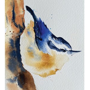 May include: Watercolor painting of a blue bird perched on a tree branch. The bird is facing to the right and has a white stripe on its head. The background is a light blue.
