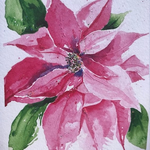 May include: Watercolor painting of a poinsettia flower with pink petals and green leaves. The flower has a glittery center and is set against a white background. The artist's signature and the year 2019 are visible in the lower left corner.