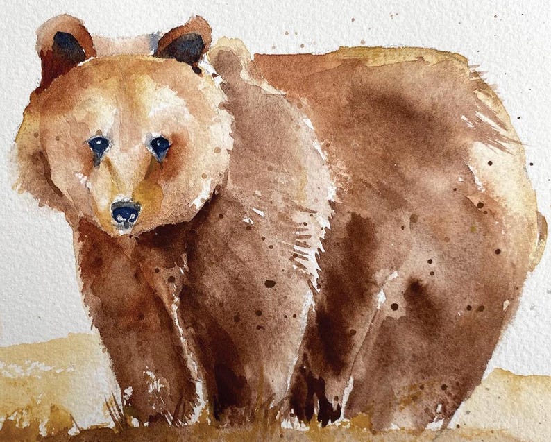 May include: Watercolor painting of a brown bear standing on a light brown background. The bear is looking directly at the viewer with its mouth closed. The bear's fur is painted with a light brown wash and has darker brown accents.