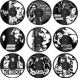 May include: Nine black vinyl record wall art pieces featuring female musicians. The records include Adele, Alannah Myles, Ariana Grande, Billie Eilish, Celine Dion, Cyndi Lauper, The Chicks, Heart, and Janet.