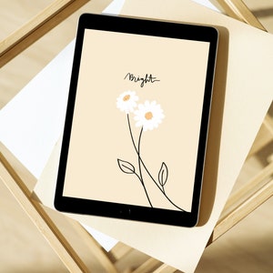 Puede incluir: Una tableta negra que muestra una ilustración digital sobre un fondo beige claro. La pantalla presenta dos margaritas blancas con centros amarillos, tallos negros finos y hojas, junto al texto manuscrito en negro Bright sobre las flores.