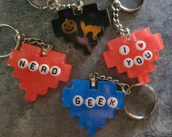 Chaveiros de coração de pixel