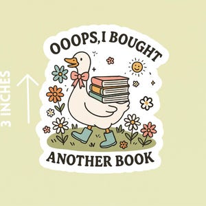 May include: A sticker featuring a cartoon goose carrying books, surrounded by flowers and a smiling sun. The text reads "OOOPS, I BOUGHT ANOTHER BOOK." The sticker is approximately 7.6 cm in height.