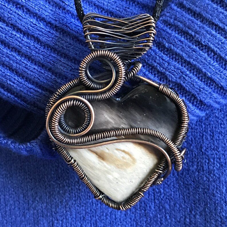 Indonesian Fossilized Palm Root Heart Pendant wrapped with a Sweeping Curve of Coiled Antiqued Copper