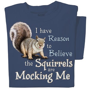 May include: A navy blue t-shirt with a graphic of a squirrel and the text "I have reason to believe the squirrels are mocking me."
