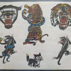 Puede incluir: Una colección de arte de tatuaje que presenta una cabeza de pantera negra, un tigre luchando contra una serpiente azul, una cabeza de tigre, una pantera negra luchando contra una serpiente azul, un gato pequeño en blanco y negro y una pantera negra.