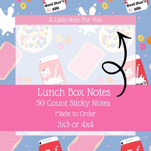 May include: Pink and blue background with illustrations of cereal, milk cartons, and pastries. The image features a pink rectangle with the text "Lunch Box Notes" and "50 Count Sticky Notes". The notes are available in 3x3 or 4x4 sizes.