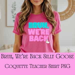 May include: A pink t-shirt with the text "BRUH, WE'RE BACK" in turquoise and pink block letters. A small cartoon goose is on the lower right. The shirt is a casual style.