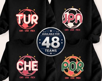 May include: Black sweatshirts with soccer ball graphics. Each sweatshirt features a different three-letter country code inside a soccer ball, with the text "CAN USA MEX" below. A central badge states "AVAILABLE FOR 48 TEAMS."