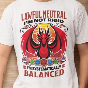 May include: White t-shirt with a red dragon graphic and the text "Lawful Neutral I'm Not Rigid I'm Systematically Balanced".