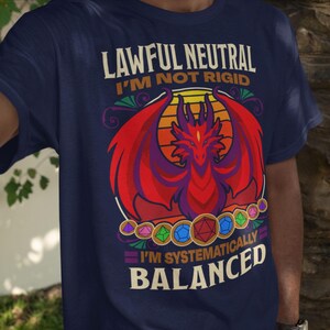 May include: A navy blue t-shirt with a red dragon graphic and the text "Lawful Neutral I'm Not Rigid I'm Systematically Balanced".