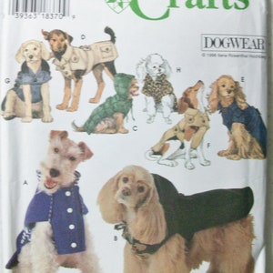 May include: A sewing pattern for dog clothes, Simplicity Crafts pattern number 9850, with illustrations of different dog breeds wearing various styles of coats, jackets, and sweaters.