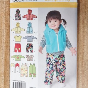 May include: Simplicity sewing pattern 1566A for sizes XXS-L, XXP-G, and TTP-G. The pattern includes instructions for making a hooded jacket, a vest, a pair of trousers, a shirt, and a hat.