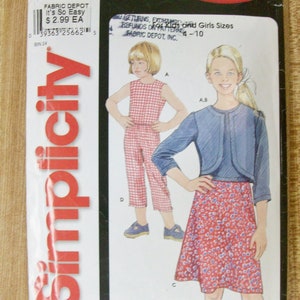 May include: A sewing pattern for girls' clothing, featuring two designs. The first design is a red and white gingham jumpsuit. The second design is a blue denim jacket with a red and white floral skirt. The pattern is from Simplicity and is labeled "It's So Easy" and "7145".