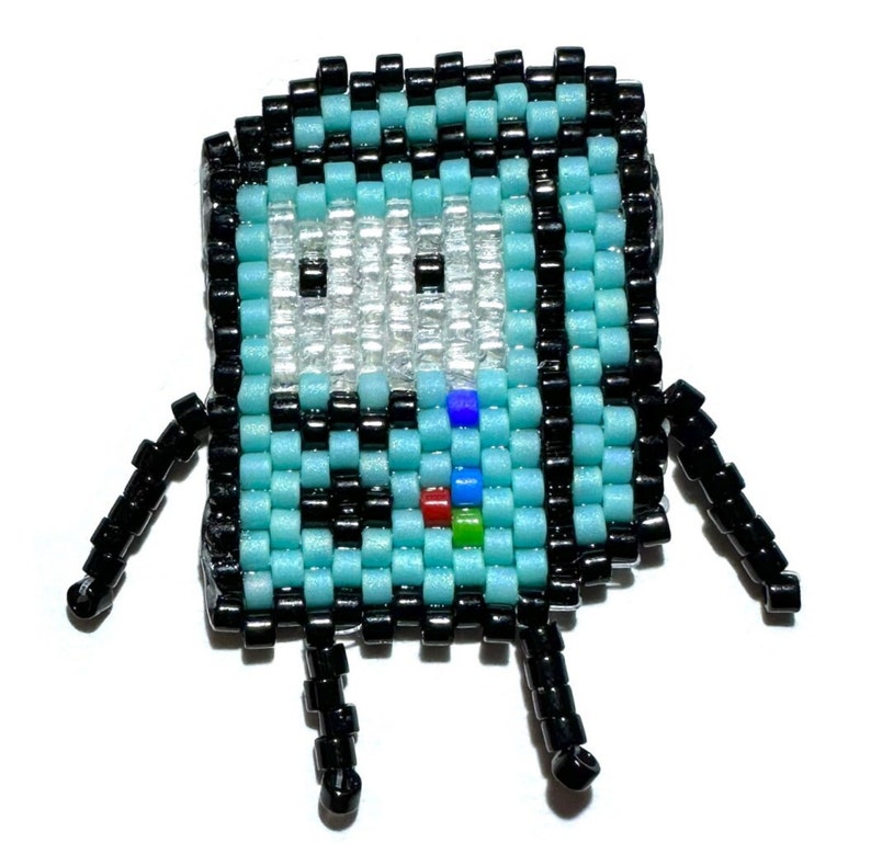 May include: A blue and black beaded figure of a robot with a white face and rainbow colored details. The robot has two small arms and legs.