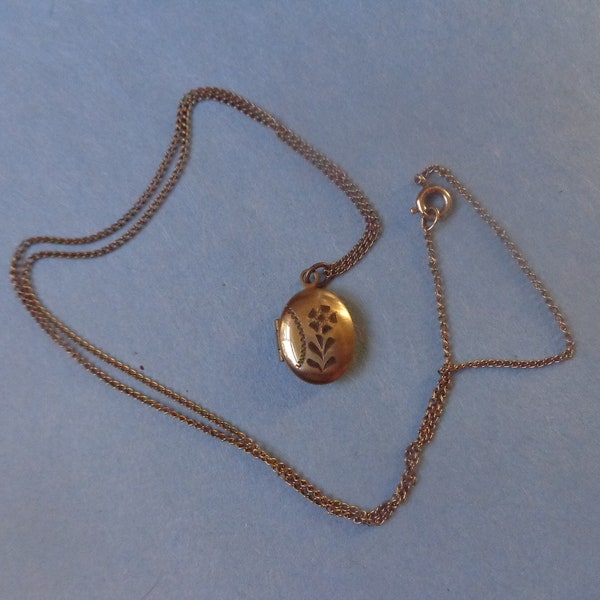 Tiny engraved locket signed CMC