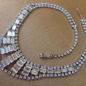 Silver tone bib necklace with clear baguette and chaton rhinestones