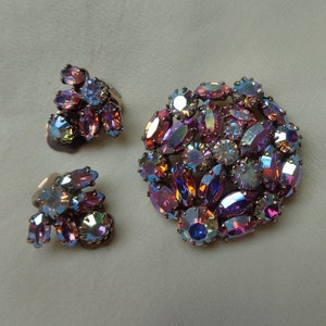 Bright brooch and clip on earrings with Aurora Borealis marquise and chaton rhinestones