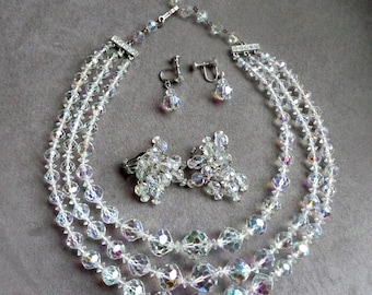 Laguna three strand crystal necklace with Aurora Borealis coating and two pairs of earrings
