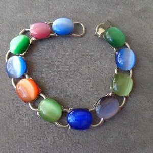 Colorful, silver tone bracelet with opalescent &quot;cat&#39;s eyes&quot; glass cabochons