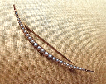 Edwardian 14 karat yellow gold crescent brooch with seed pearls