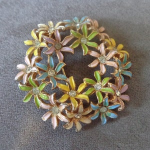 Enameled floral wreath brooch in pastel colors