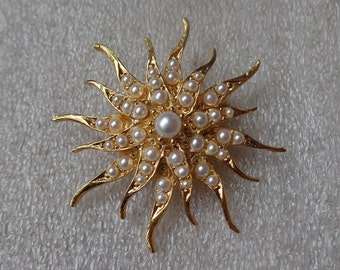 Gold tone sunburst brooch with faux pearls