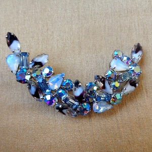 Large crescent brooch with array of glass stones