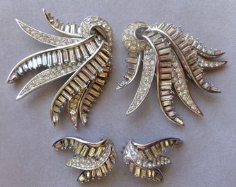 Boucher double fur clips and matching clip on earrings with clear crystals.