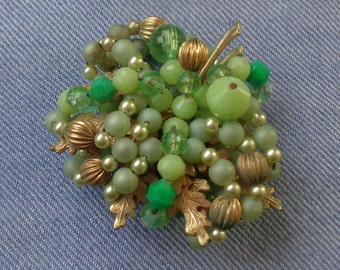 Gold tone brooch with oak leaves, wired beads and faux pearls