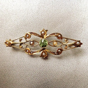Lacy Edwardian 14K gold brooch with peridot and seed pearls
